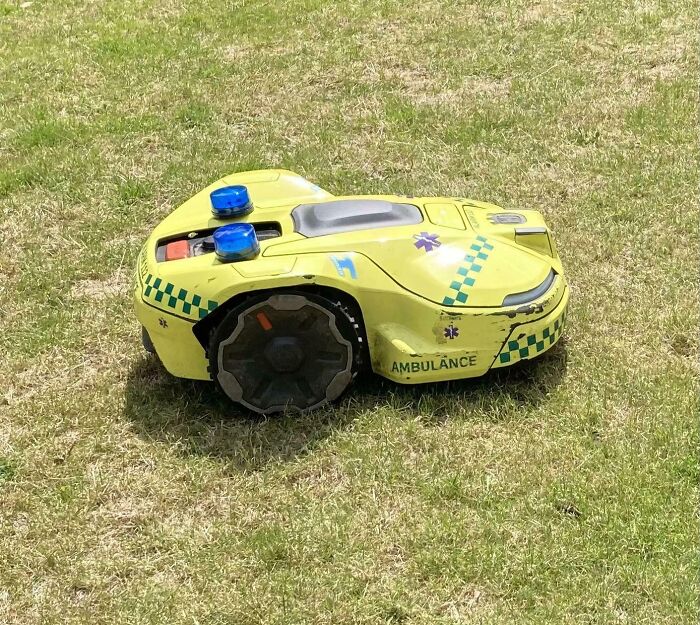 Autonomous robotic ambulance vehicle in grassy area showcasing impressive things countries implemented for emergency response.