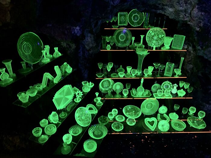 Glowing vintage glassware displayed on shelves, showcasing impressive things countries implemented that left people in awe.