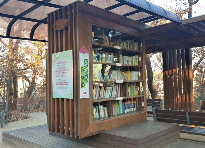 Outdoor public bookshelf and reading space implemented by a country, showcasing impressive community library concept.