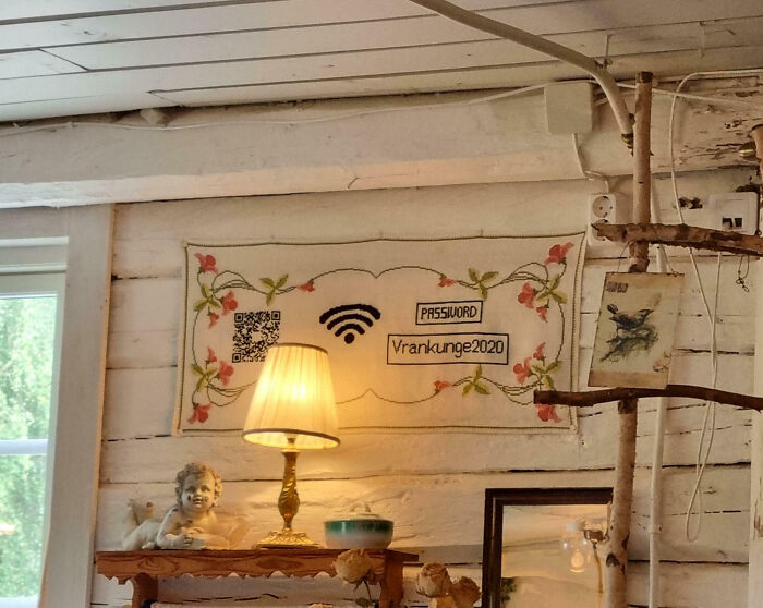 WiFi password creatively displayed with embroidery and QR code inside a rustic country setting, an impressive country implementation.