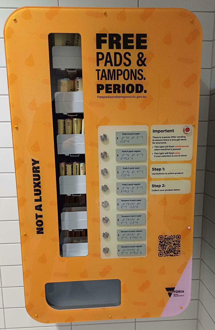Vending machine offering free pads and tampons with braille buttons, an impressive item countries implemented for public access.