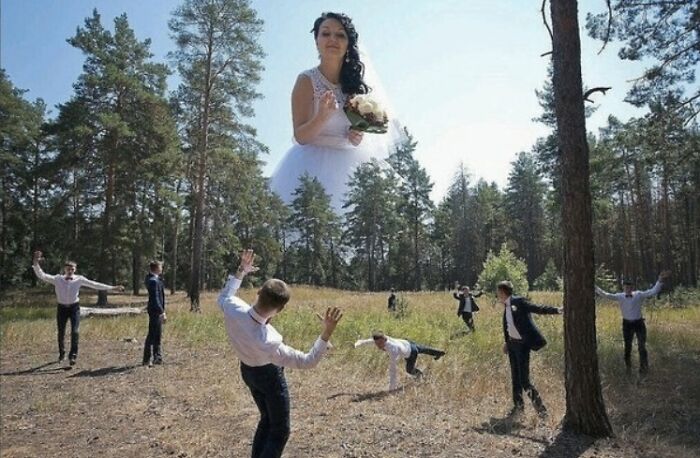 Bride’s head floating above groomsmen in forest, creating an awkward wedding photo that is both funny and cringe-worthy.
