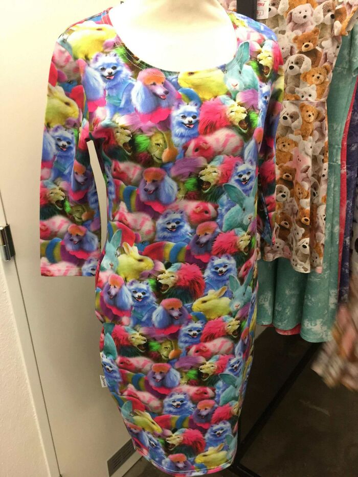 Dress covered in brightly colored animals with unusual patterns creating a hilarious fashion fails look on display.