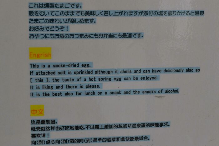 Sign with a hilariously incorrect English translation describing a smoke-dried egg, showcasing Japan translation errors.