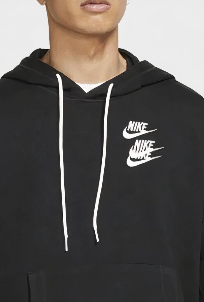 Close-up of a black hoodie with multiple overlapping Nike logos, showcasing a hilarious fashion fail in branding design.