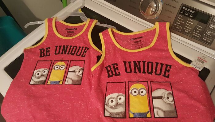 Two pink toddler tank tops with Minions and the words Be Unique placed on a washing machine, showcasing hilarious fashion fails.