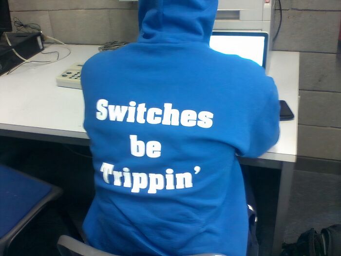 Person wearing a blue hoodie with a spelling error on the back, illustrating hilarious fashion fails in casual clothing. Person wearing a blue hoodie with a spelling error on the back, illustrating hilarious fashion fails in casual clothing.