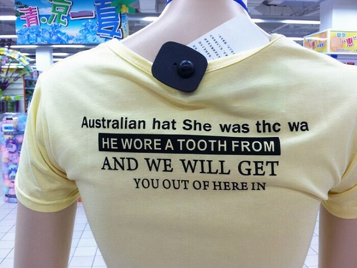 Yellow shirt on mannequin with poorly printed and misspelled text, illustrating hilarious fashion fails in a store setting.