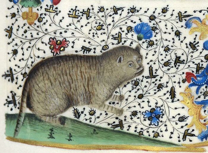 Medieval old painting depicting a comically rendered animal against an ornate floral background with bright colors.
