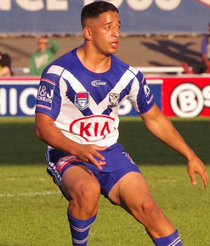 Brandon Wakeham in Bulldogs rugby uniform during a match, focused and in action on the field.