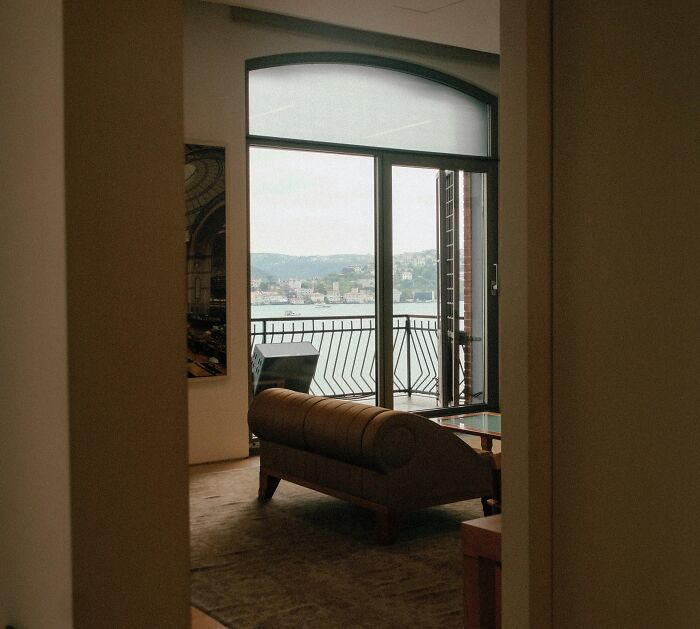 Luxury living room with a sea view balcony, highlighting rich people’s out of pocket lifestyle and financial perspectives.