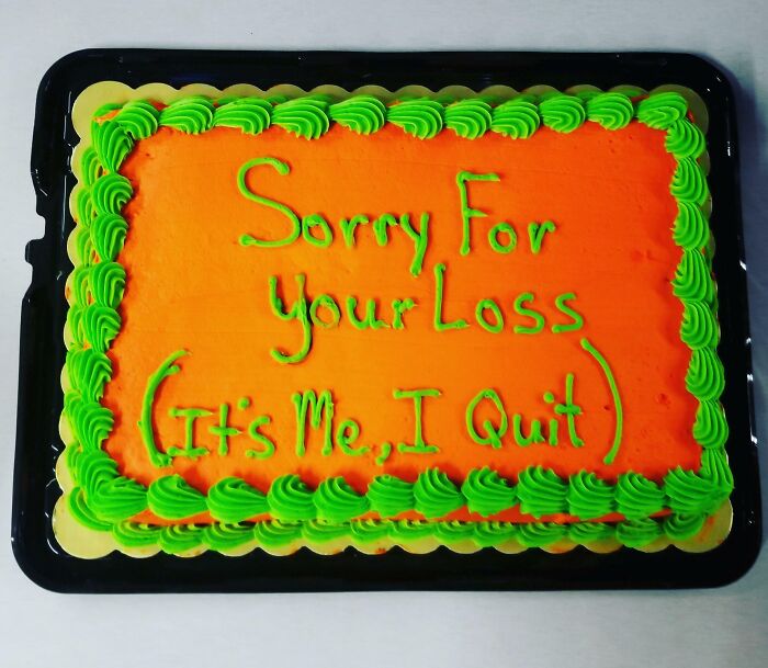 Rectangular orange cake with green icing border and funny message reflecting honest emotions about quitting.
