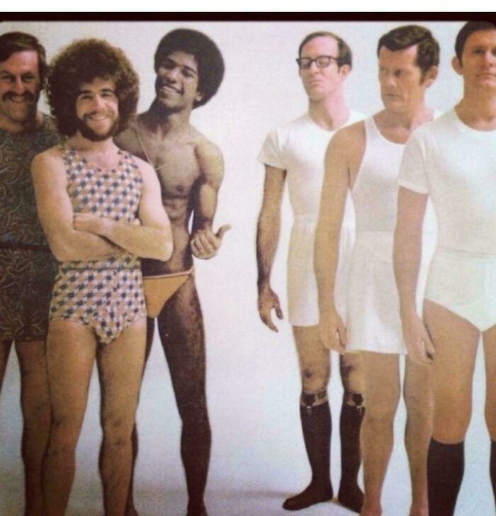 Group of men modeling vintage advertisements swimwear and underwear in a retro style photo from the 1970s era.
