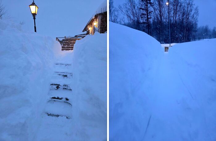 Snow-covered outdoor stairs and walkways illuminated by a lamp, showcasing cozy winter scenes without stepping into the cold.