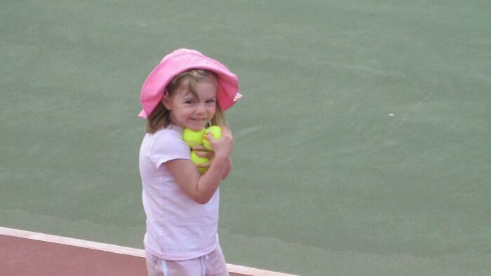 Young girl in a pink hat holding tennis balls on a court, illustrating themes of unsettling history and crime stories.