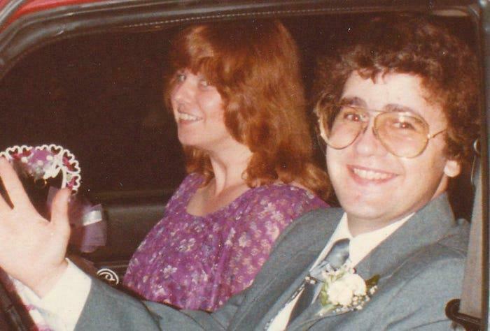 A smiling couple in a car, representing unsettling history and crime stories of people who vanished without a trace.