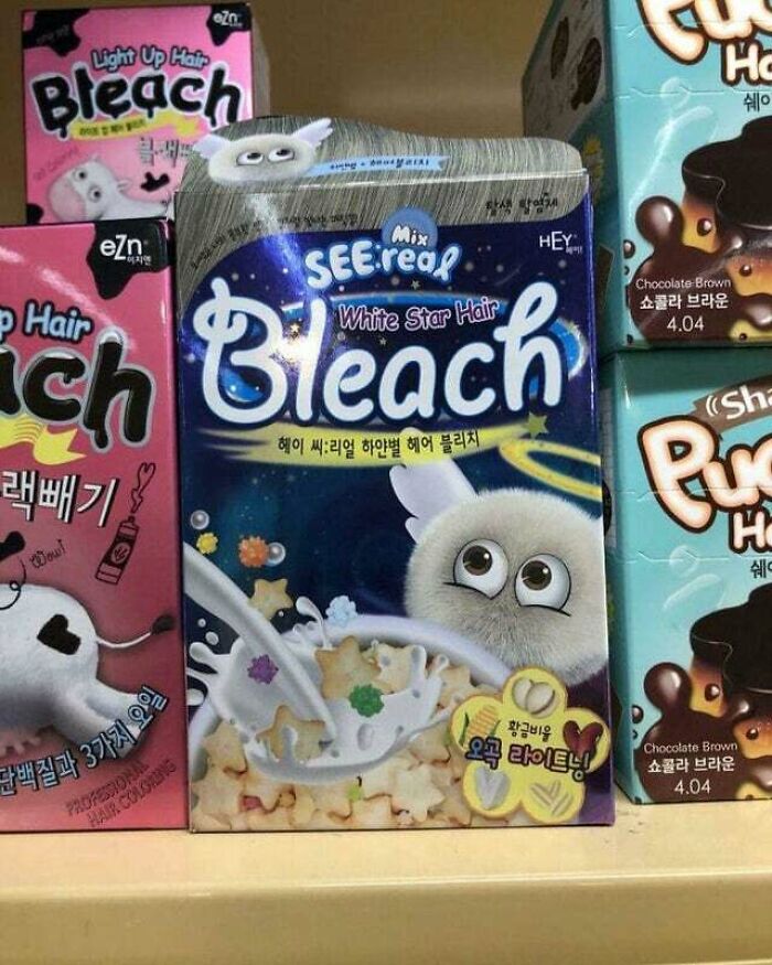 Cereal box designed as hair bleach with cartoon character, star-shaped cereal, and milk splash on store shelf.
