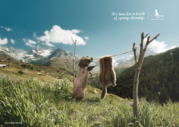 Humorous print advertisement showing a marmot hanging its own fur on a clothesline in a mountain landscape.