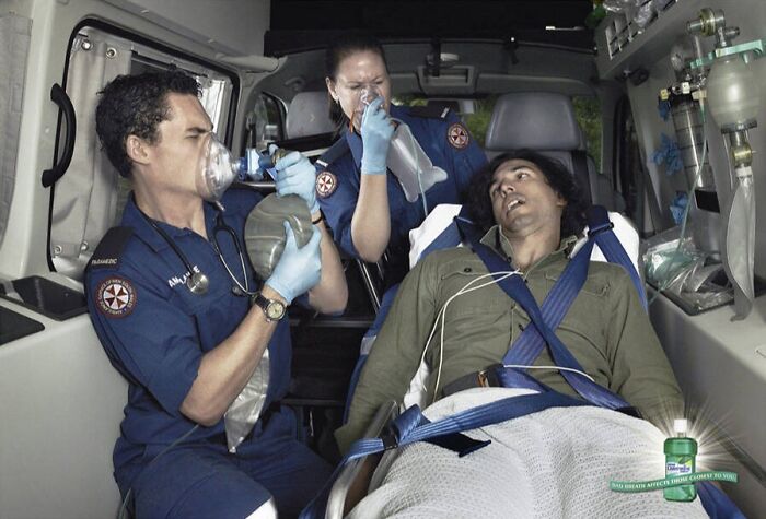 Paramedics inside an ambulance using humor and creativity in a print advertisement to highlight a breath freshener product.