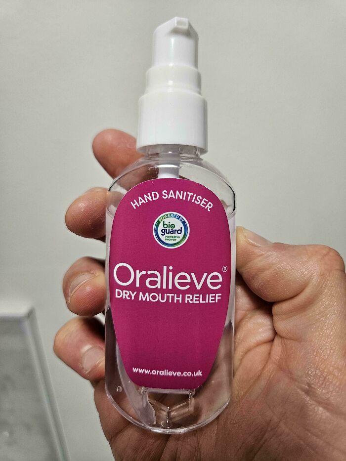 Hand sanitizer bottle labeled for dry mouth relief, illustrating a terrible product design that causes confusion.