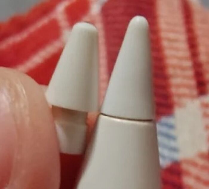 Close-up of worn down everyday object tips showing unexpected wear and tear on white plastic parts.