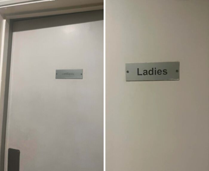 Worn down restroom door signs showing fading on the gentlemen sign and clear ladies sign, everyday objects worn down unexpectedly