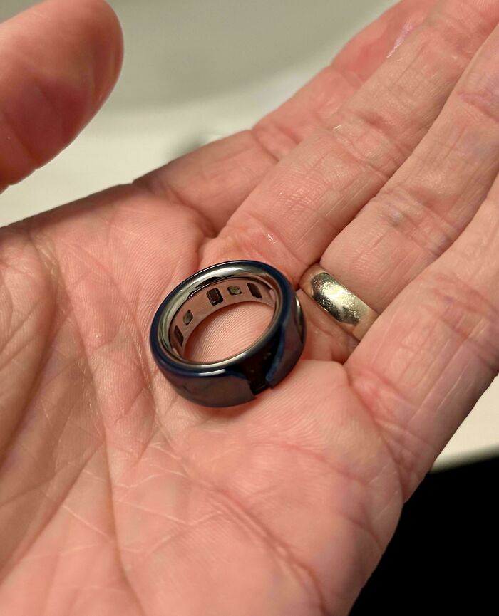 Hand holding a broken expensive ring, an example of unfortunate and stupid fails with costly damage.