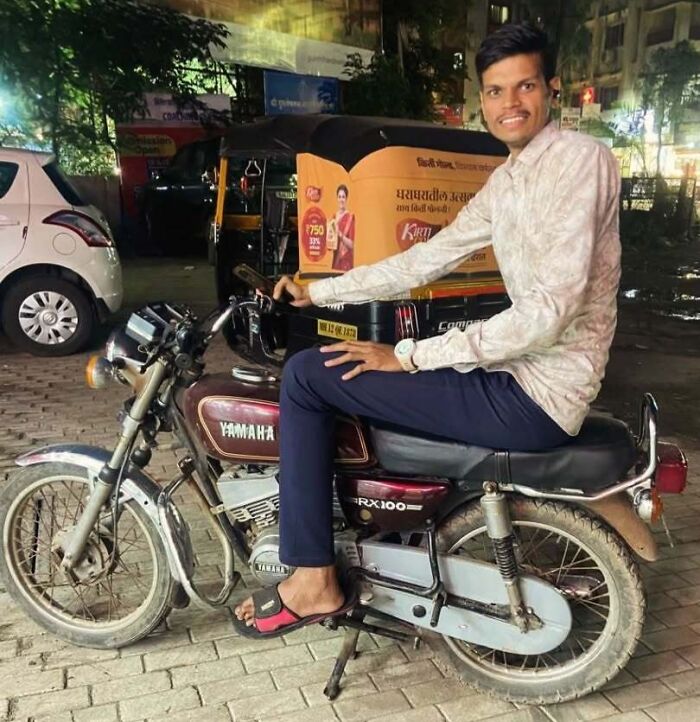 Tall man sitting on a motorcycle, highlighting common struggles only tall people face in everyday situations.