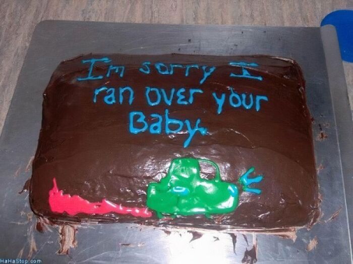 Chocolate cake with a green car and funny message written in blue icing, showcasing humorous cake designs and honest emotions.