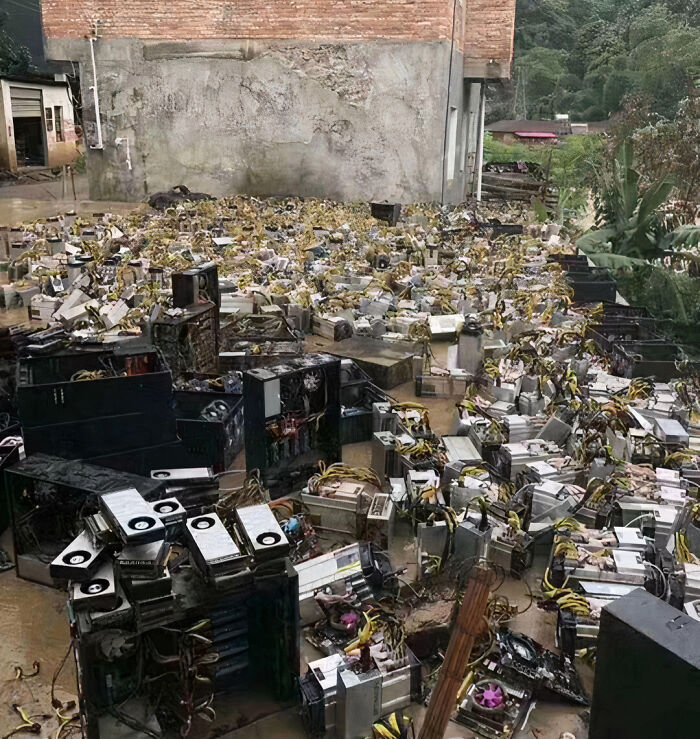 Large flooded room filled with damaged electronic mining equipment showing expensive fails and costly mistakes.