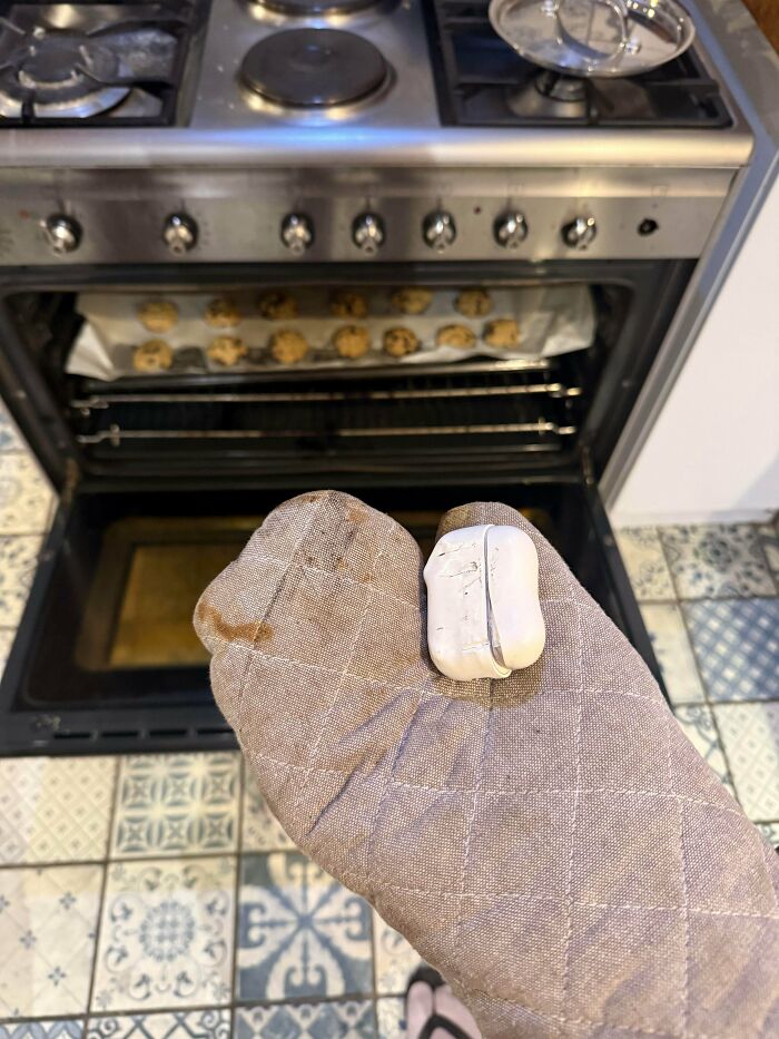 Oven mitt melted on hand while baking cookies, showing expensive cooking fail and unfortunate kitchen mistake.
