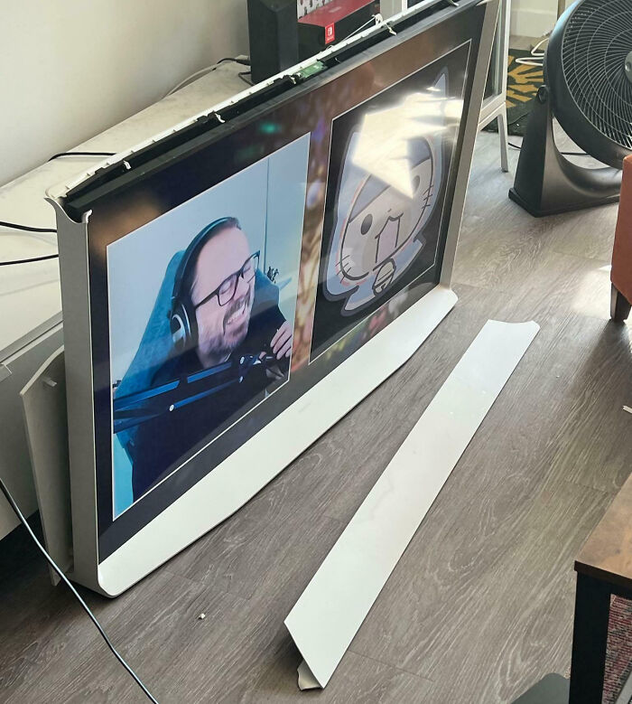 Broken flat screen TV lying on the floor showing a video call, illustrating expensive and unfortunate fails.