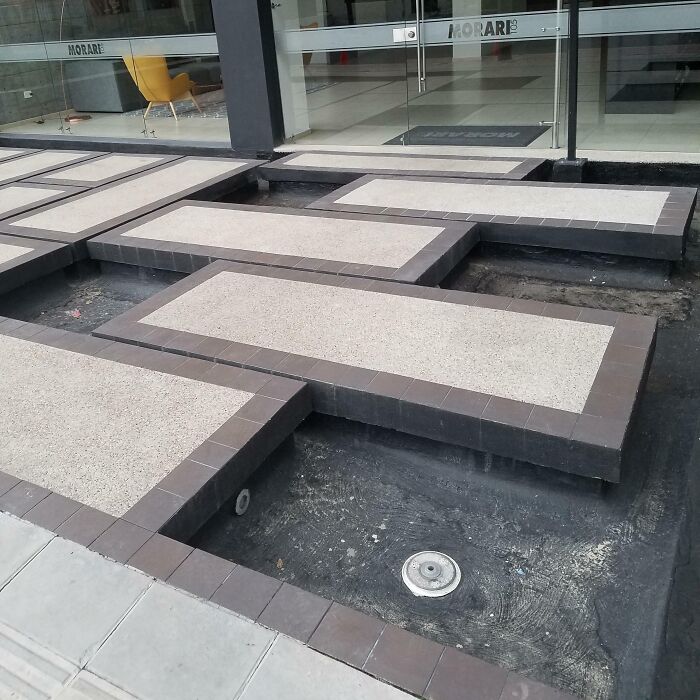 Raised platforms designed without stairs or ramps, an example of terrible product designs that make no sense in public spaces.