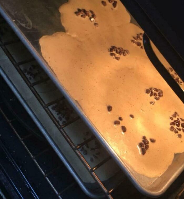 Thick dessert batter overflowing in a baking pan with chocolate chips, showing a common way people managed to ruin dessert.