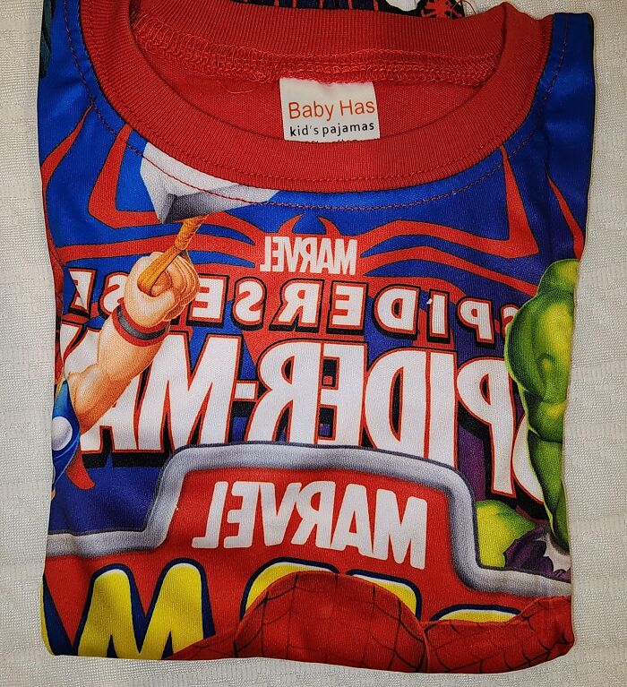 Folded kids pajama with a Marvel Spider-Man design showing reversed and confusing text by designers.