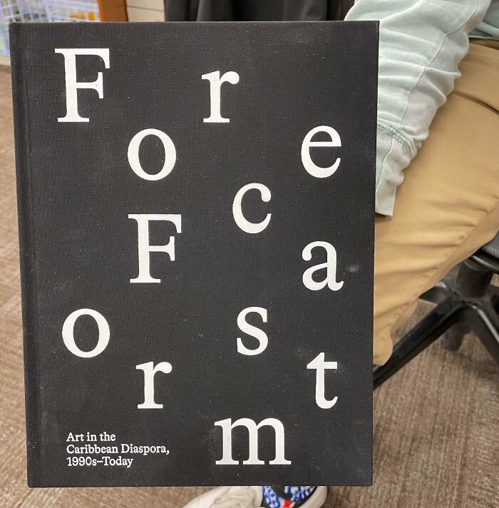 Black book cover with scattered white letters arranged randomly, illustrating designers failed attempts at writing and typography.