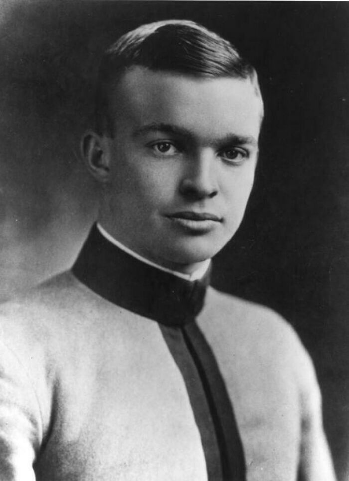 Black and white portrait of a young man in early 20th century uniform, a vintage US history photo showing the past.