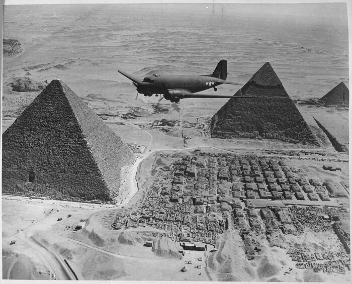 US history photo of a military plane flying over the pyramids, showing a unique perspective not found in textbooks