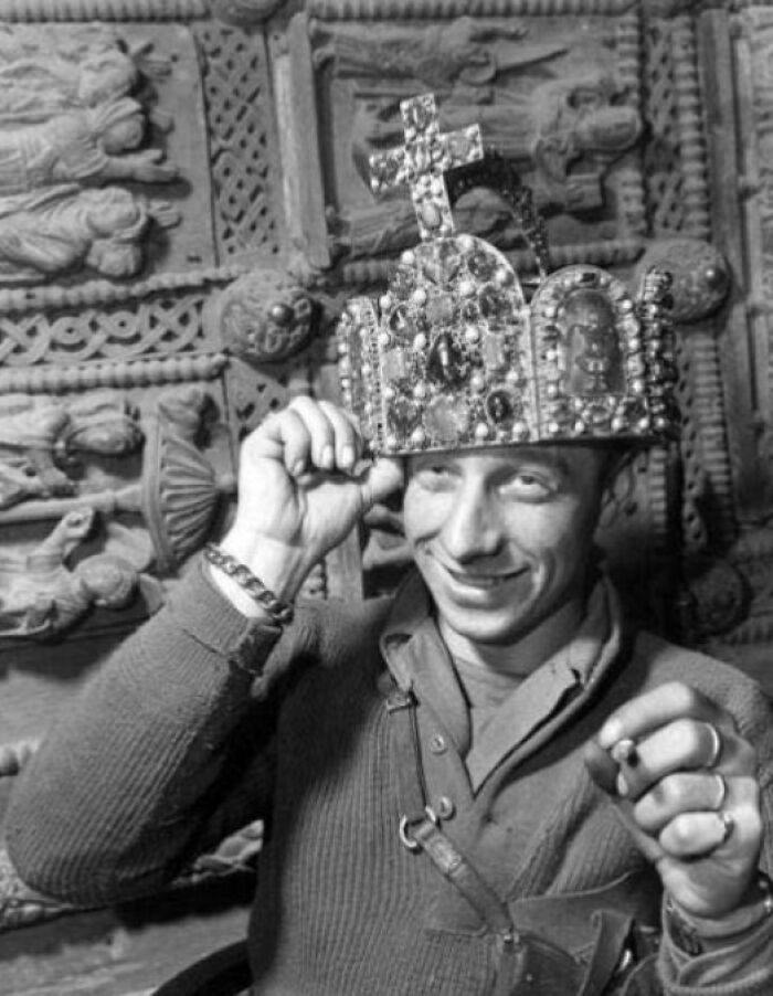 Man wearing a decorated crown and smiling, a unique US history photo showing the past beyond traditional textbooks.