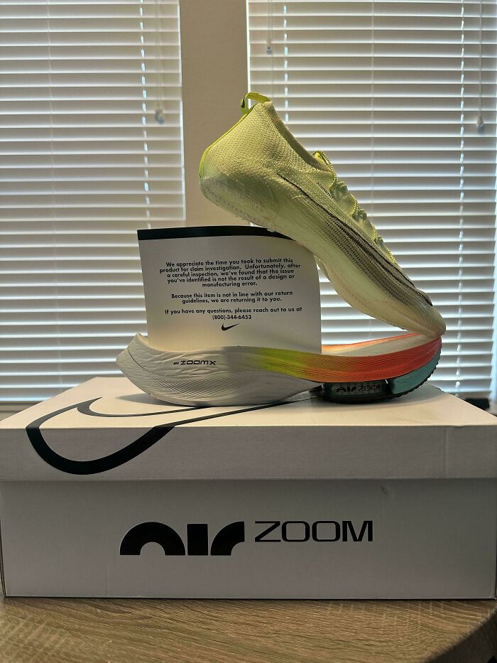 Nike running shoe with sole detached placed on box, illustrating unfortunate events making you feel better about your day.