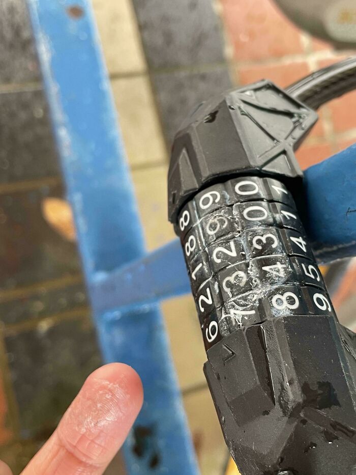 Combination bike lock damaged and numbers scratched, an unfortunate event causing frustration and inconvenience.