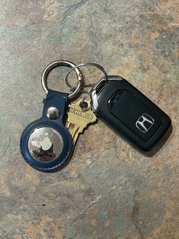 Car key, house key, and broken Apple AirTag on a keyring, showing an unfortunate event that can make your day better.