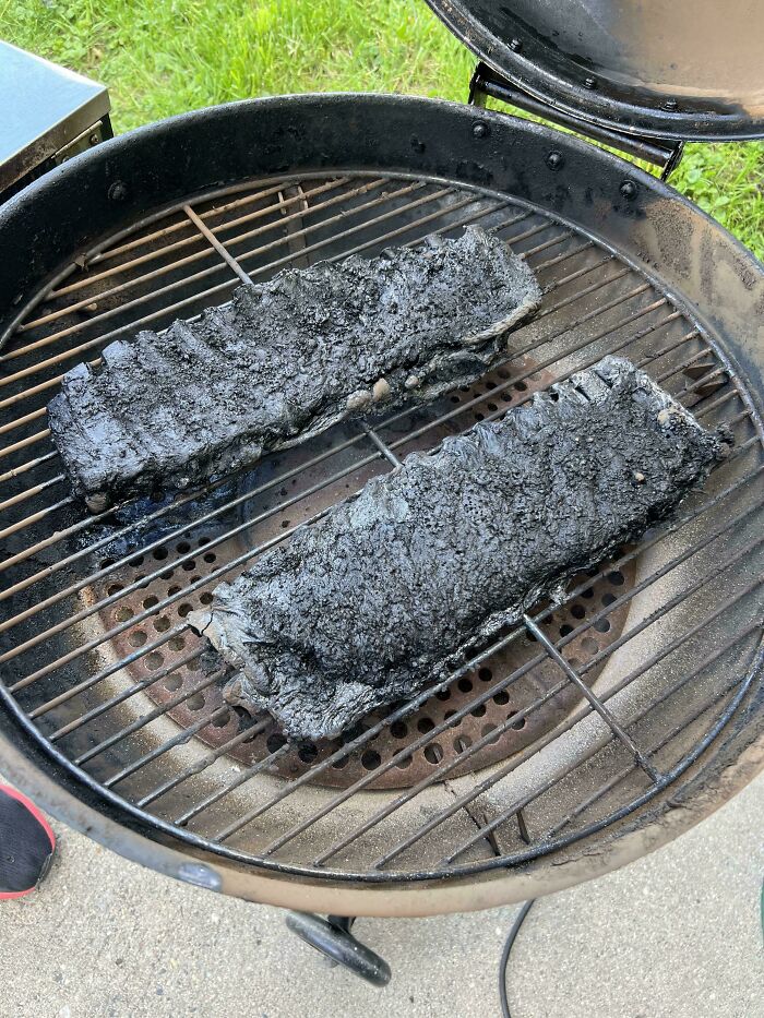 Burnt ribs on grill showing one of many unfortunate events that highlight cooking fails and disaster moments.