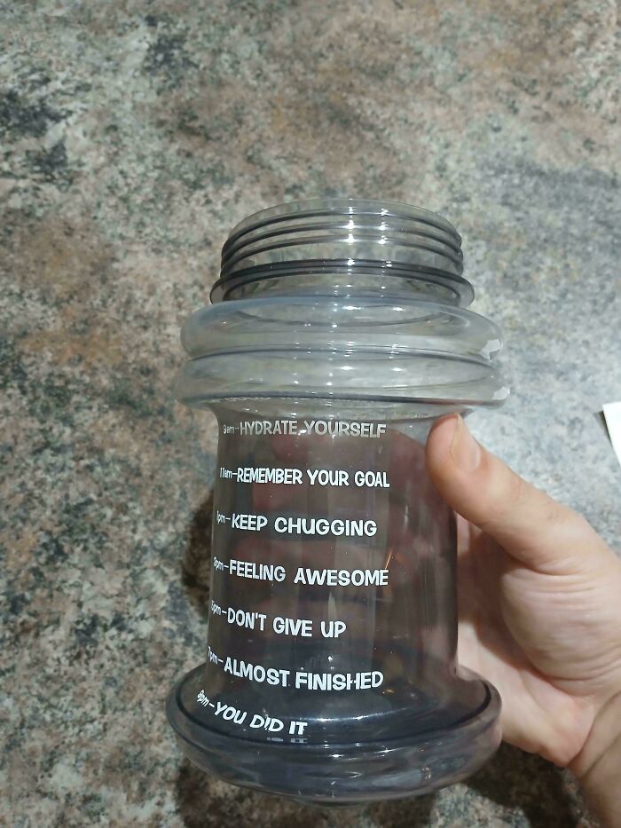 Clear plastic water bottle with motivational time markings, a relatable photo from unfortunate events to brighten your day.
