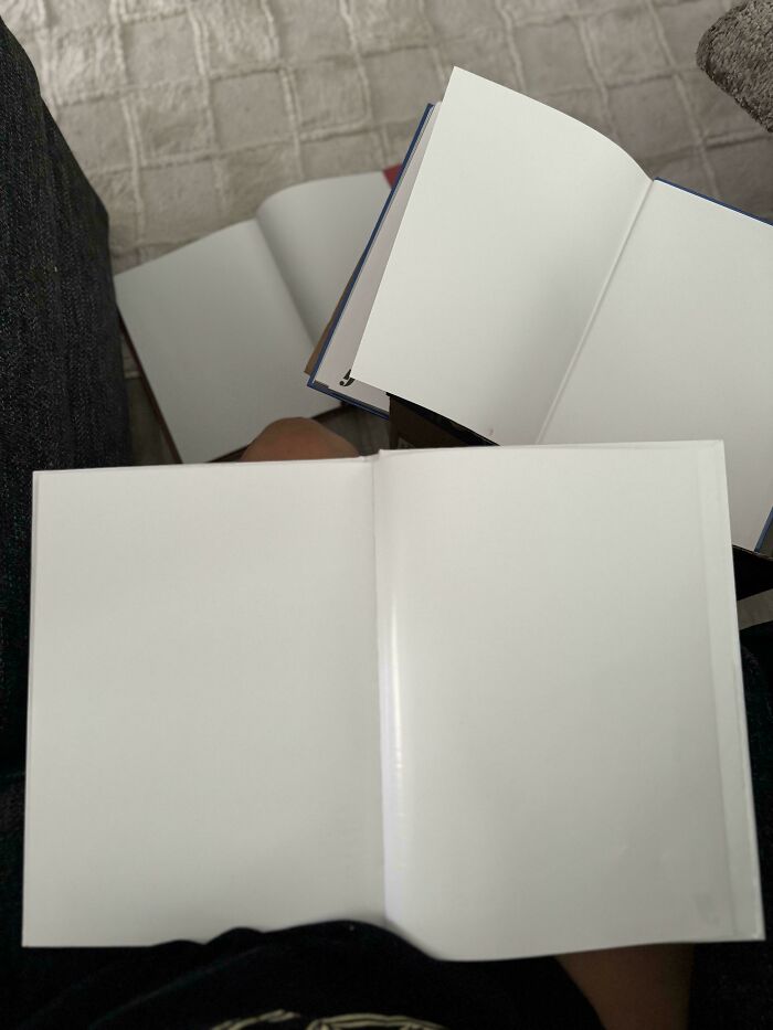 Blank pages inside multiple opened books, an unfortunate event that might make you feel better about your day.