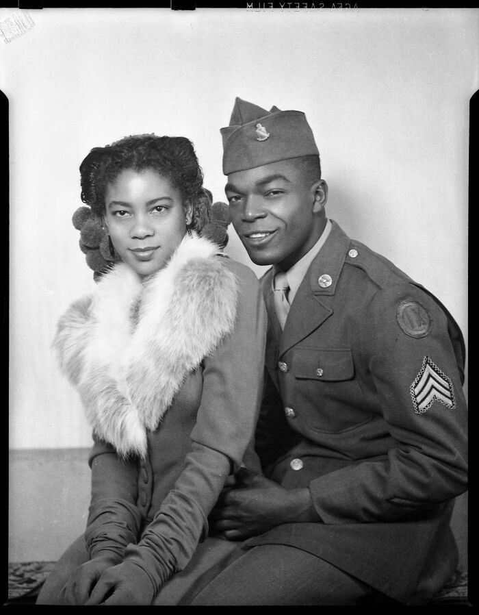 Black and white historical photograph of an African American soldier in uniform with a woman wearing a fur collar, depicting a world you'd hardly recognize.