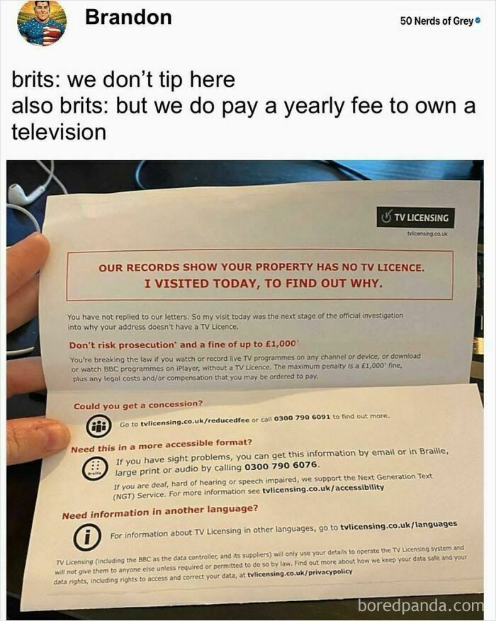 Hand holding a TV licensing warning letter, highlighting dystopia with bizarre legal requirements in everyday life.