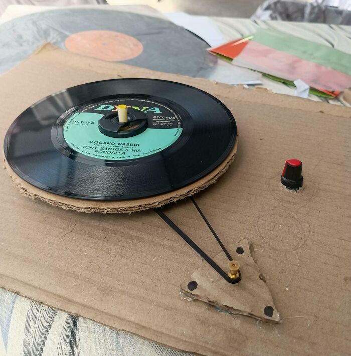 DIY record player made from cardboard and vinyl, a creative and functional example of if it’s stupid but it works.