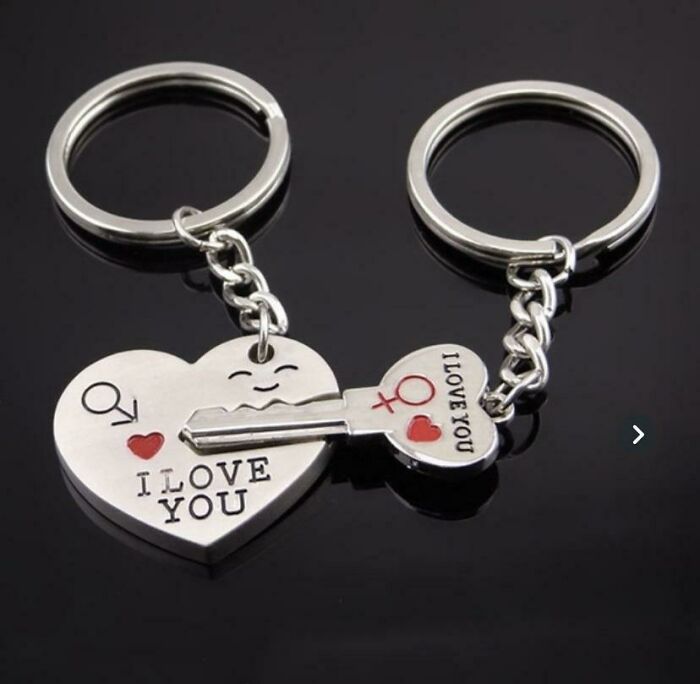 Matching key and heart keychains with gender symbols and I love you text, illustrating gendered nonsense concept.