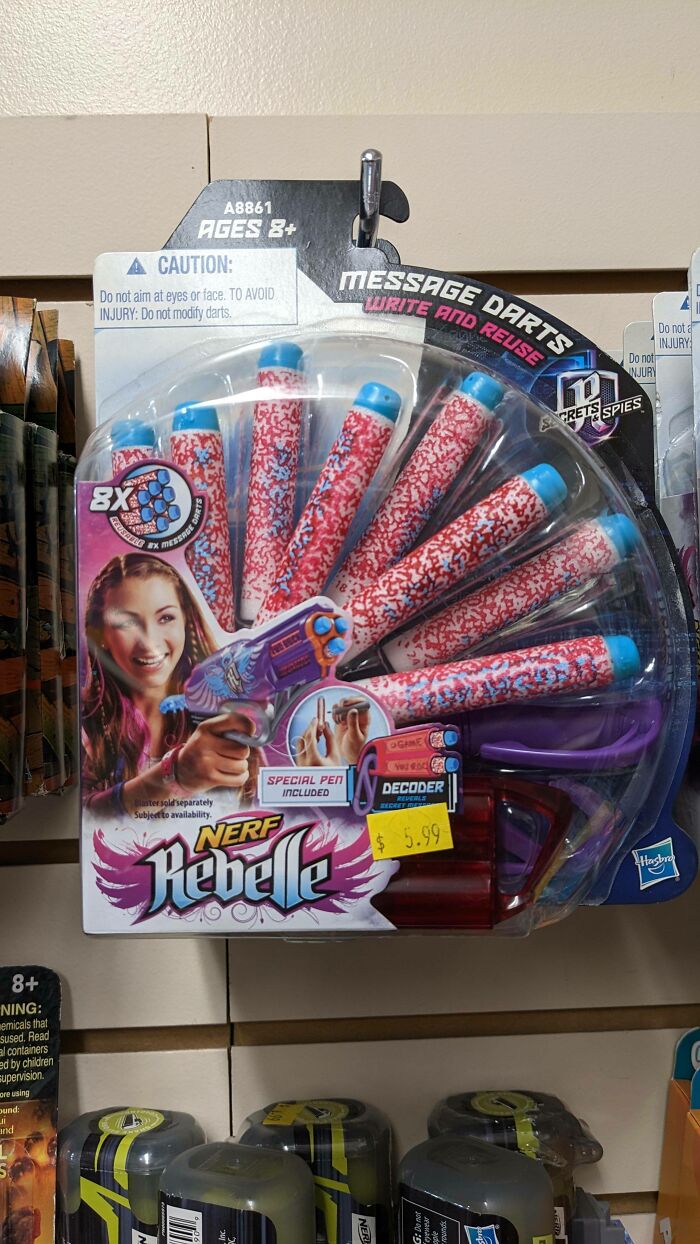 Nerf Rebelle message darts toy packaged with pink and blue foam darts, highlighting gendered nonsense in toy marketing.